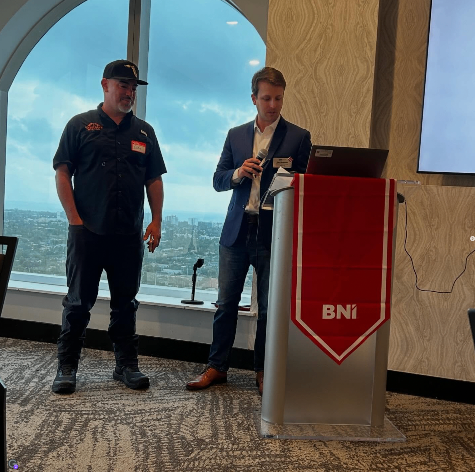 Members presenting together at the BNI podium