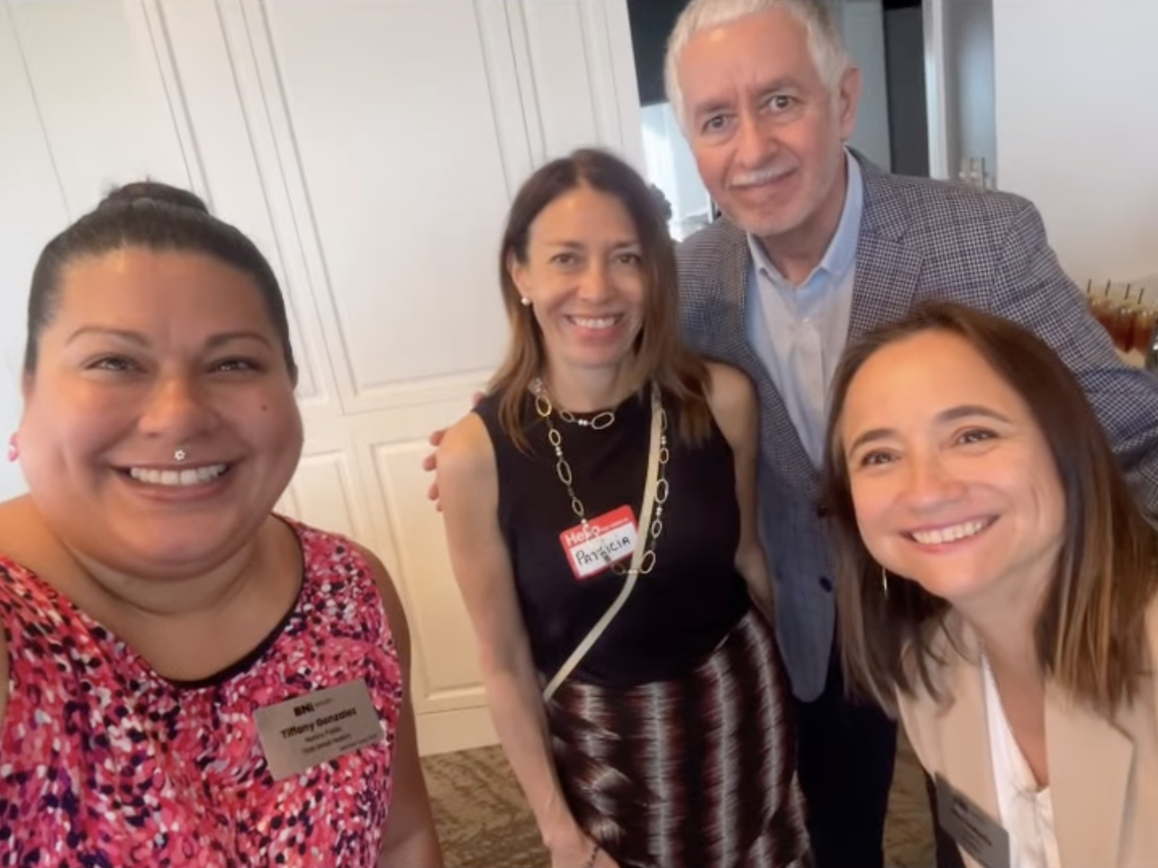 Four BNI Integrity members smiling for a group selfie